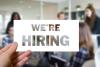 Sign with "We're hiring"